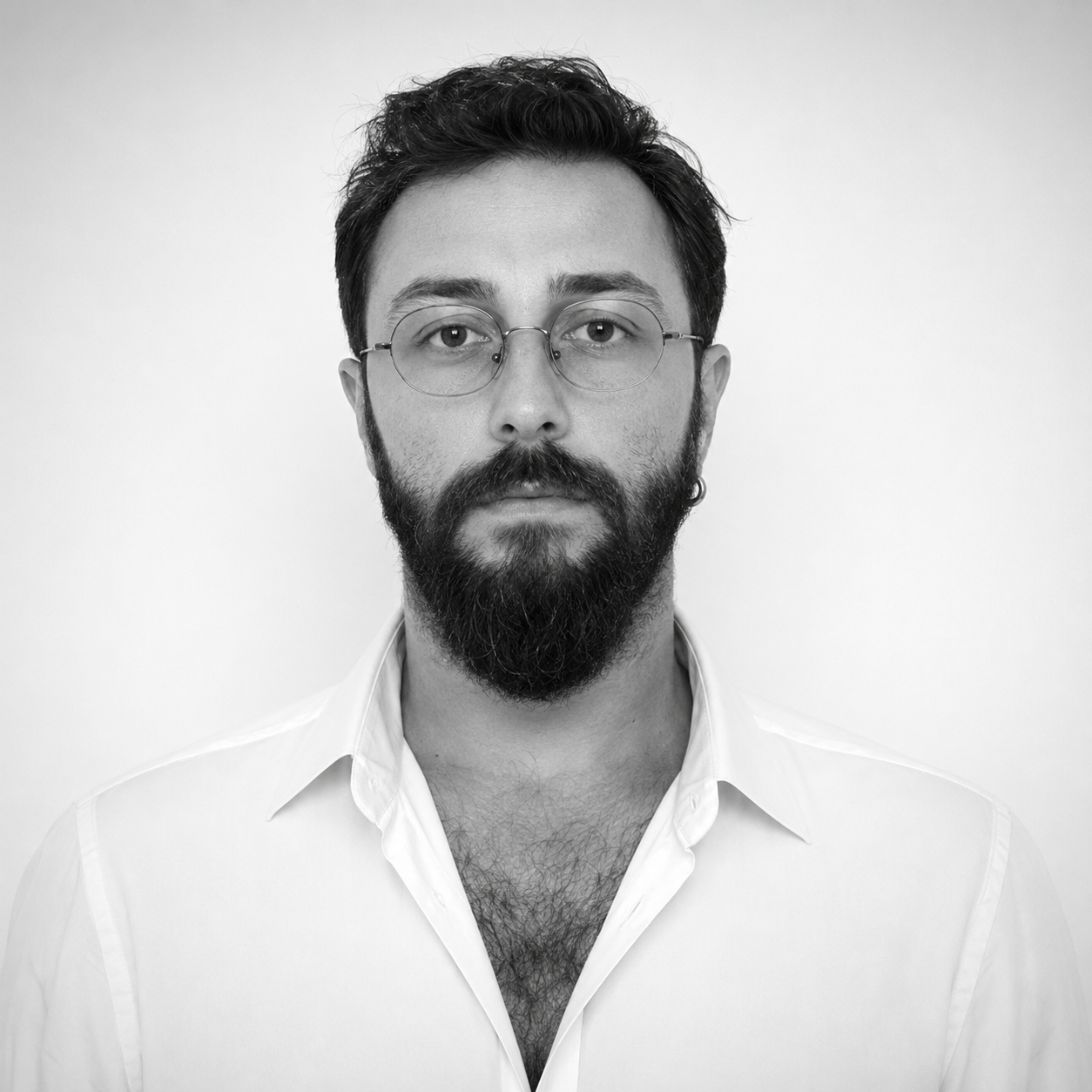 Formal black and white portrait of Halil Mert Erdoğan